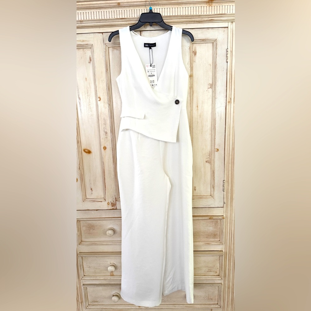 ZARA with Asymmetric Crepe Vest Jumpsuit Ecru. Zipper on the side. 58” tall.